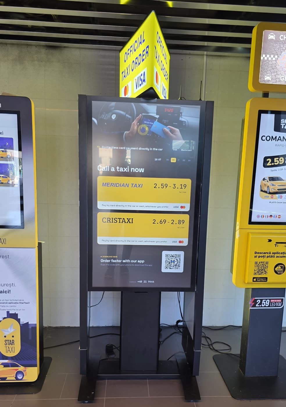 Official taxi ordering kiosk in the arrivals hall at Otopeni airport